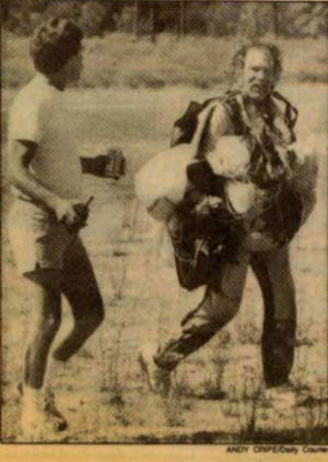 Old newspaper photo: Zimmo and John walking together.